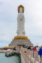 Statue of Guanyin on the territory of Buddhist center Nanshan on a cloudy day