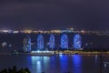 Night view of the Phoenix island in the Sanya city with bright multi-colored illumination buildings, structures and ships. Sanya Royalty Free Stock Photo