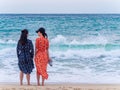SANYA, HAINAN, CHINA - 4 MAR 2019 - Two young Asian Chinese women tourists at the beach with copy space Royalty Free Stock Photo
