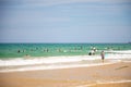 Sanya, Hainan Island, China - 22.06.2019: People on the beach and in the sea in Area for Surfing, Hainan, China Royalty Free Stock Photo