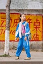 Young adorable girl wearing school uniform, Sanya, Hainan Island, China