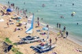 Sanzhejka, Ukraine, August 05, 2018: preparation of sailing catamarans to go to sea on a sandy beach