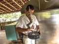 Farmer makes quality test of freshly milked milk to be sent to the dairy industry