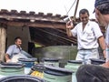 Farmer makes quality test of freshly milked milk to be sent to the dairy industry