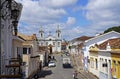 Typical street with baroque church in the background, Sao Joao del Rei, Brazil Royalty Free Stock Photo