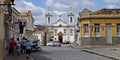 Typical street with baroque church in the background, Sao Joao del Rei, Brazil Royalty Free Stock Photo