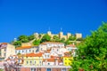 Sao Jorge Castle medieval building on hill and colorful multicolored traditional houses in Lisbon Lisboa