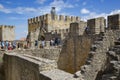 Sao Jorge castle or St. George castle with visitors Royalty Free Stock Photo