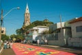 Colorful sand carpet on a street at the Holy Week