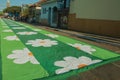 Colorful sand carpet on a street at the Holy Week