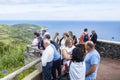 Sao Miguel Island, Azores - June 24, 2019: A Group of European Tourists Admiring the Beautiful Scenery of the Green Rolling Hills