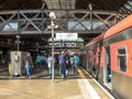 Moving inside the Luz Station, trains and passengers at the boarding and landing platforms