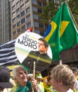 Elderly holding poster in support of Sergio Moro and Operation Lava Jato, on Avenida Paulista