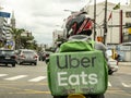 Worker Uber Eats on the motorcycle delivers food to customers in Sao Paulo city