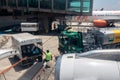 Petrobras Aviation tanker truck with fuel and workers loading luggage in the aircraft yard Royalty Free Stock Photo