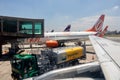 Etrobras Aviation tanker truck with fuel and workers loading luggage Royalty Free Stock Photo