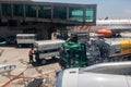 Petrobras Aviation tanker truck with fuel and workers loading luggage Royalty Free Stock Photo