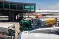 Petrobras Aviation tanker truck with fuel and workers loading luggage in the aircraft yard Royalty Free Stock Photo