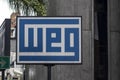 Plate with the logo of the WEG equipment industry, at the headquarters of the company`s