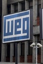 Plate with the logo of the WEG equipment industry, at the headquarters of the company`s