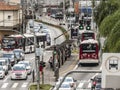 Traffic of buses, cars and pedestrians in Santo Amaro Avenue,