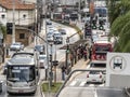 Traffic of buses, cars and pedestrians in Santo Amaro Avenue