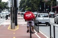 Worker ifood on the bicycle delivers food to customers in Paulista Avenue, Sao Paulo city