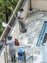 Worker man clean a swimming pool Royalty Free Stock Photo