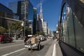 Man pulls cart with recyclable materials on Paulista Avenue