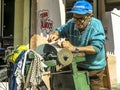 old man works as a walking grinder of knives and scissors Royalty Free Stock Photo