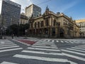 Sao Paulo, Brazil, March 20, 2021. Pedestrian crossings and facade of the Municipal Theater at Ramos  de Azevedo Square, during Royalty Free Stock Photo