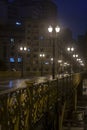 Blured of rainy night view of the iron grid of the Santa Ifigenia viaduct