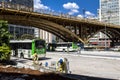 Construction worker and movement of the Correio Square Bus Termianal and view of the Santa Ifigenia Viaduct in