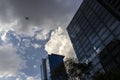 Business airliner flies over the roof of office building in Faria Lima Avenue, west side of Sao Paulo city