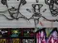 Colorful mural of street art about people in cartoon style and different grafitti letters