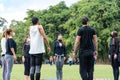 Sao Paulo, Sao Paulo, Brazil. July, 04 2021. 28-year-old Brazilian young man giving yoga class to a small group in the public