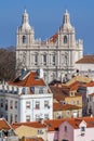 Sao Vicente de Fora Monastery, Alfama District orange rooftops and Tagus River estuary. Lisbon, Portugal Royalty Free Stock Photo