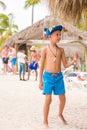 SAONA, DOMINICAN REPUBLIC - MAY 25, 2017: Boy on the sandy beach of the island. Copy space for text. Vertical.