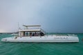 SAONA, DOMINICAN REPUBLIC - OCTOBER 29, 2015: Group of tourists party on yacht