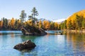 Saosea Lake with yellow larch trees, Canton Grison, Switzerland