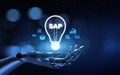 SAP Systems Applications and Products Illustrated with a Robot Hand Pressing a Button on a Virtual Screen. 3D render