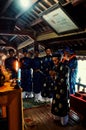 local religious leaders are blessing a a bridge and showing some food sacrifice in traditional dress with candles