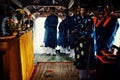 local religious leaders are blessing a a bridge and showing some food sacrifice in traditional dress with candles