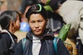 Portrait of an Black Miao Hmong minority woman wearing traditional costume at the street in Sapa, Vietman.