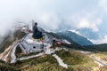 SAPA, VIETNAM - MAR 14, 2019: Giant buddha statue on the top of Fansipan mountain peak, Backdrop Beautiful view blue sky and fog Royalty Free Stock Photo