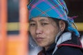 Portrait hmong ethnic woman on the street market in mountain village Sapa, North Vietnam