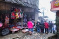 View of people traveling at Cat Cat village, in the rainy and foggy morning Laocai province, Sapa, Vietnam.