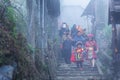 View of people traveling at Cat Cat village, in the rainy and foggy morning Laocai province, Sapa, Vietnam