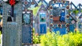 Sapanta, Maramures, Romania - June 17, 2022: Painted blue wooden monuments in an unique in the World