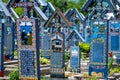 Sapanta, Maramures, Romania - June 17, 2022: Painted blue wooden monuments in an unique in the World